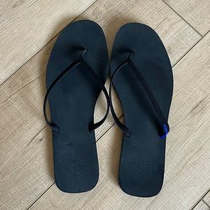 Rothy’s black flip flops